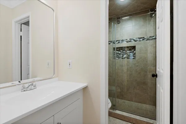 a bathroom with a bathtub and a shower