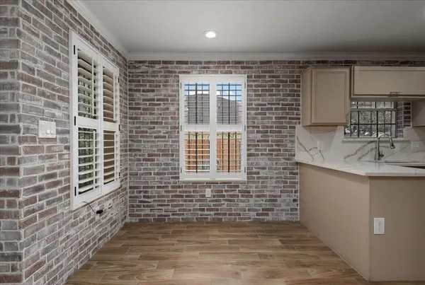 a bathroom with a sink a mirror and shower