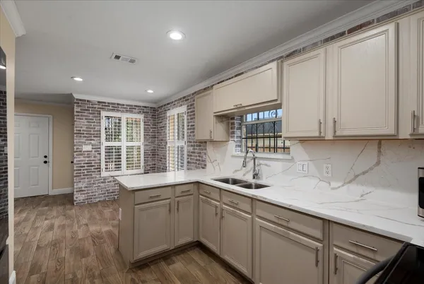 a kitchen with a sink and cabinets