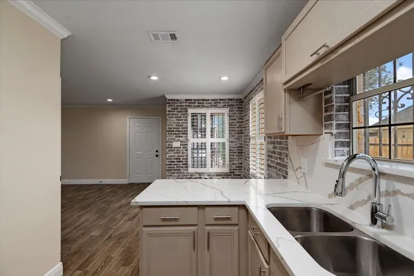 a kitchen with a sink and a refrigerator