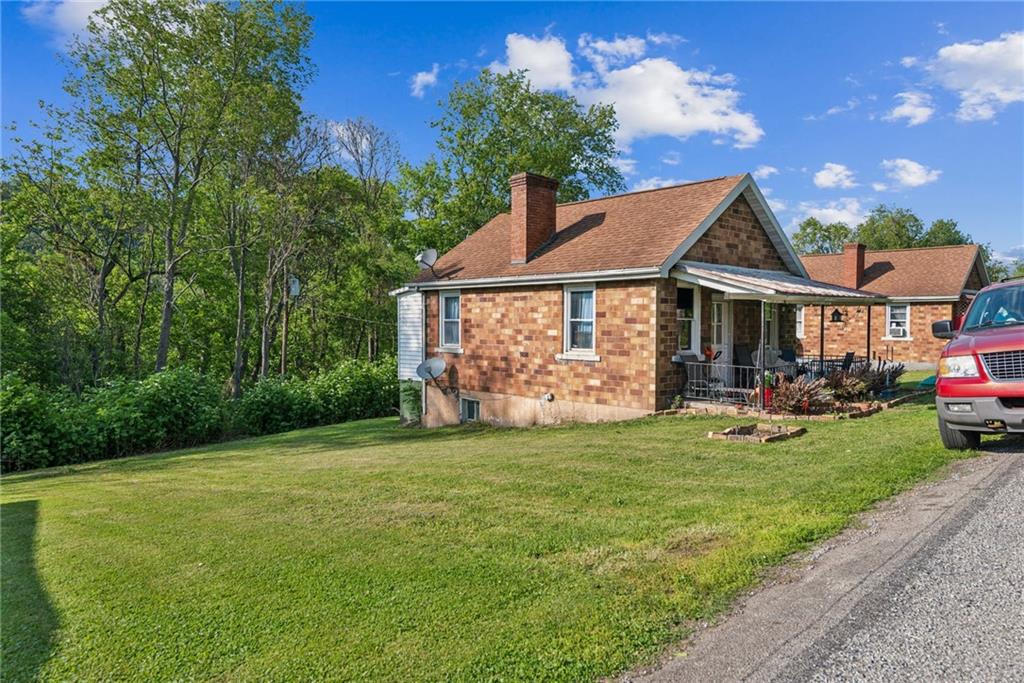 375 Reduction Road Smithton, PA 15479 - Photo 24 of 30 a view of a house with a yard and porch