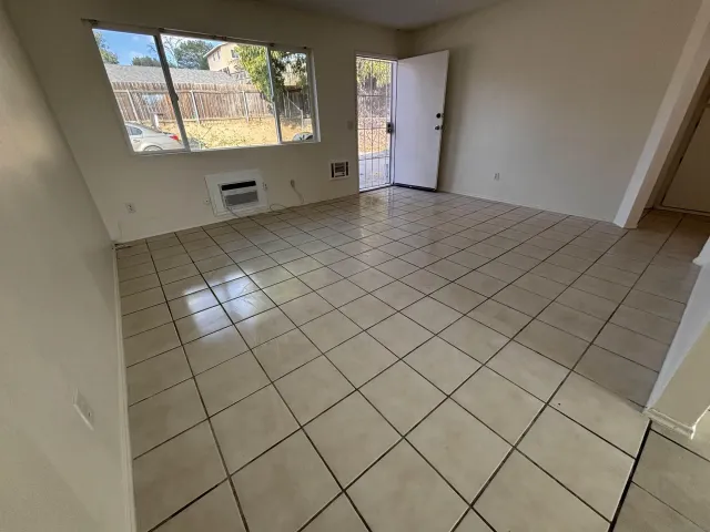 a view of an empty room and window