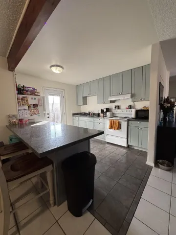 a room with furniture and a flat screen tv