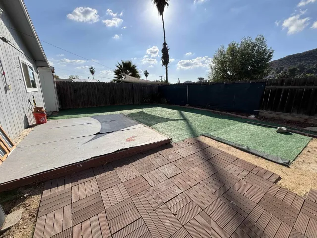 a view of a backyard with a sitting area