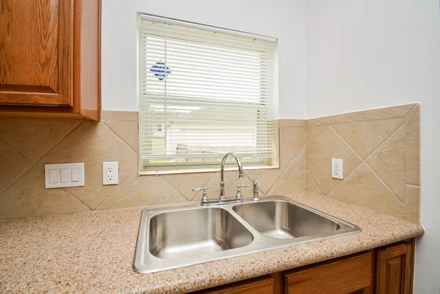 a sink sitting next to a window