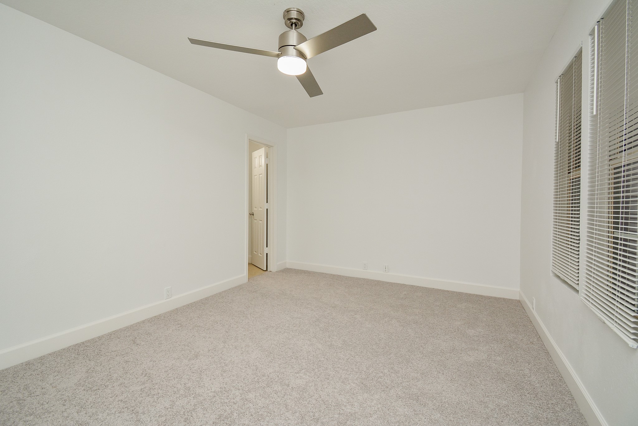 29725 Sullivan Oaks Drive Spring, TX 77386 - Photo 15 of 32 an empty room with a ceiling fan and a window