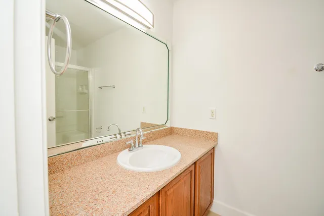 a bathroom with a sink and a mirror