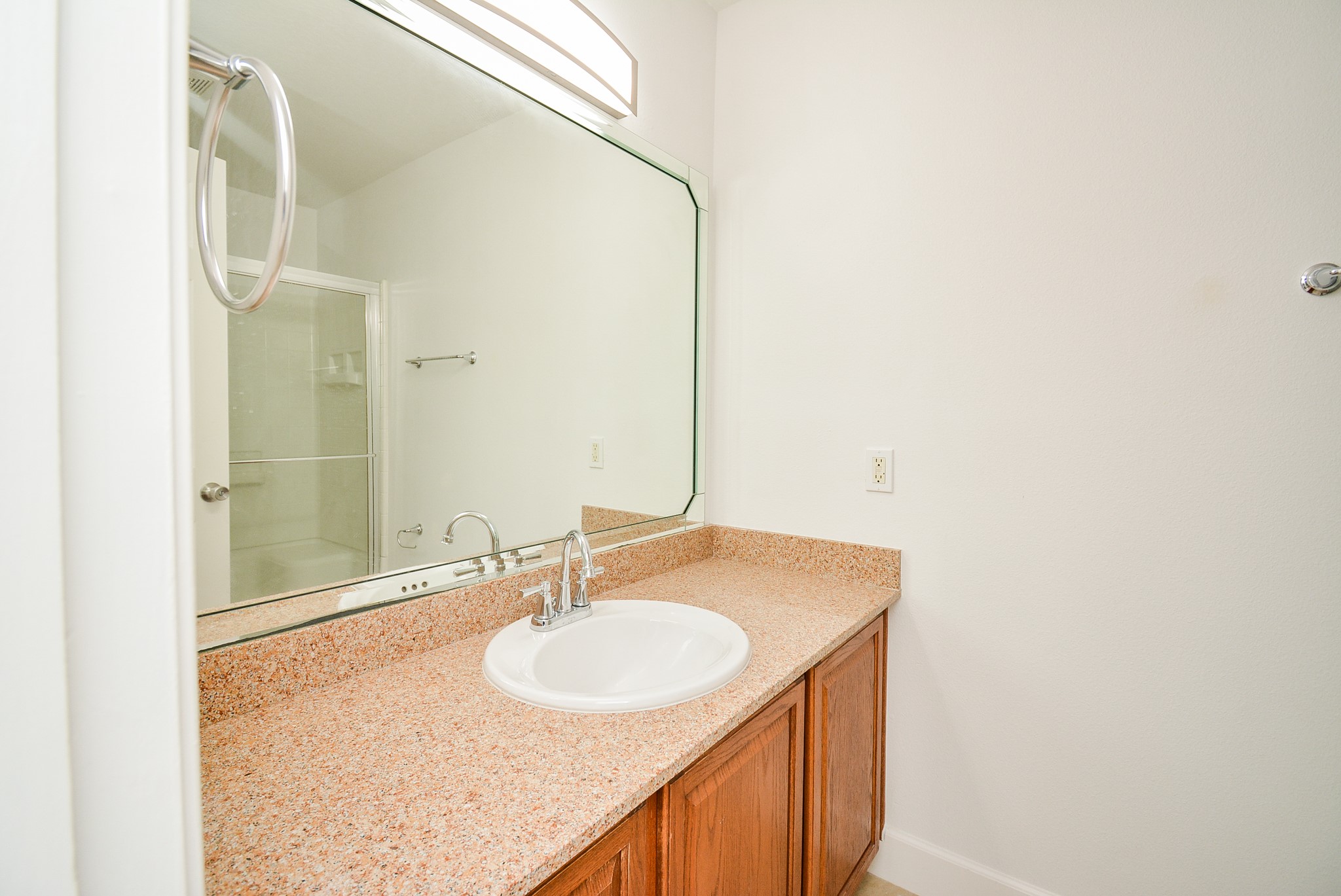 29725 Sullivan Oaks Drive Spring, TX 77386 - Photo 17 of 32 a bathroom with a sink and a mirror