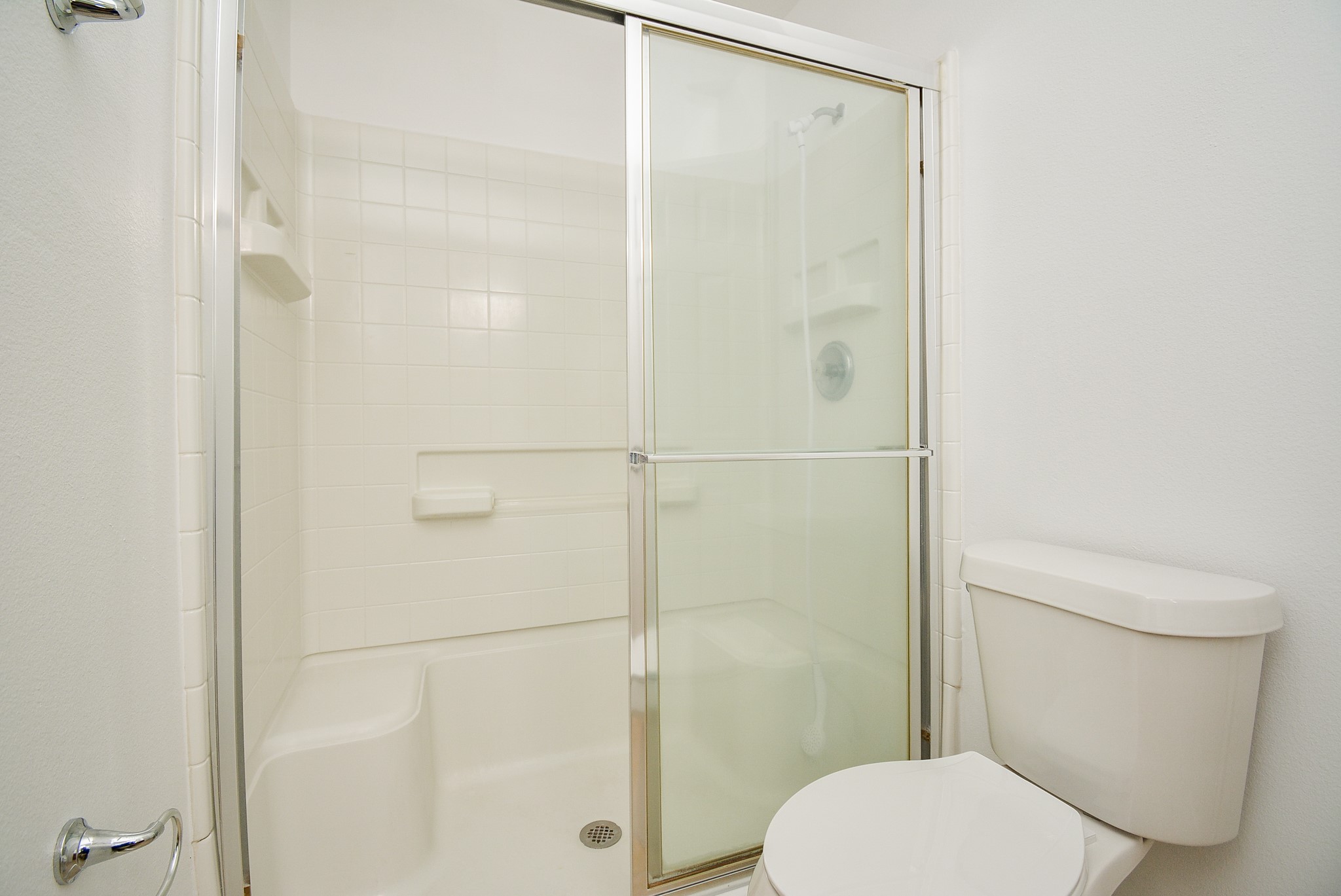 29725 Sullivan Oaks Drive Spring, TX 77386 - Photo 18 of 32 a white toilet sitting next to a bathroom sink