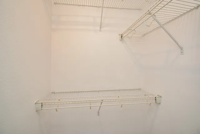 a view of small space with racks on the wall