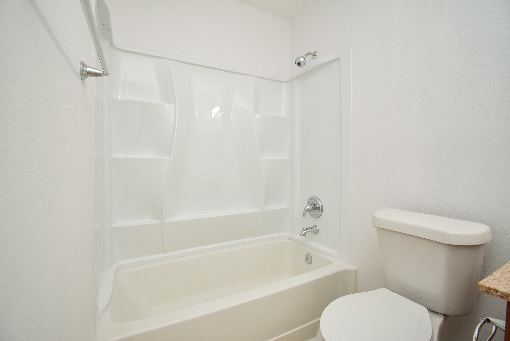 29725 Sullivan Oaks Drive Spring, TX 77386 - Photo 26 of 32 a white toilet sitting next to a bath tub