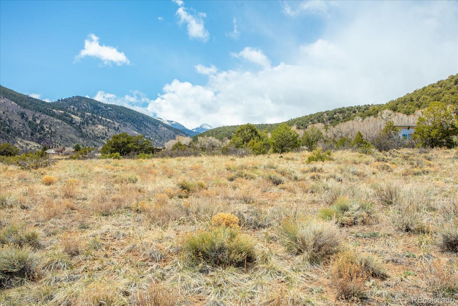 8209 Rocky Mountain Road Salida, CO 81201 - Photo 8 of 27 a view of a lake with a mountain in the background