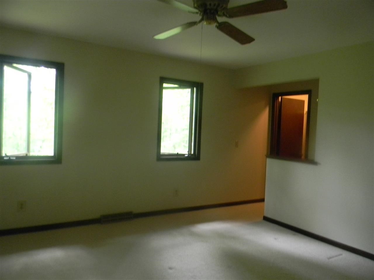 2150 Lake Summerset Road Davis, IL 61019 - Photo 16 of 18 an empty room with a window and a ceiling fan