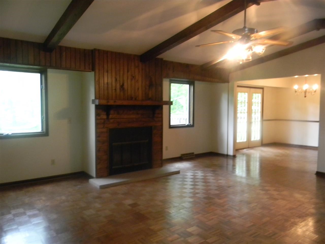 2150 Lake Summerset Road Davis, IL 61019 - Photo 10 of 18 an empty room with windows and fireplace