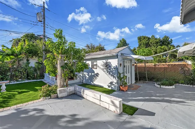 a view of a park with iron fence