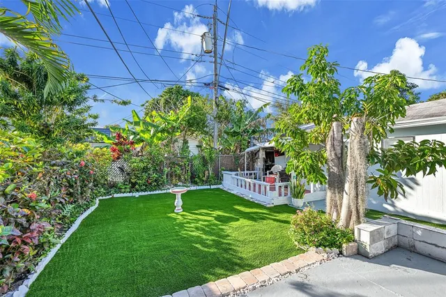 a view of a chair and table in the garden