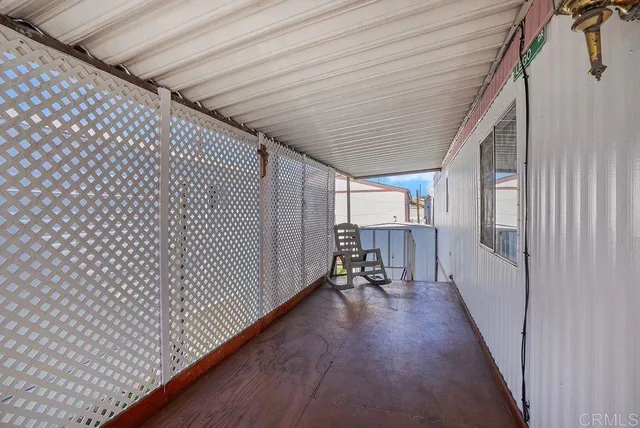 a hallway with table and chairs