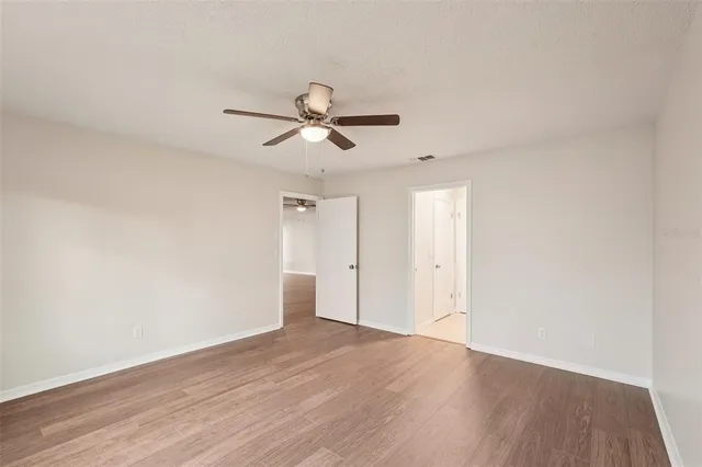 a view of an empty room with a floor to ceiling window
