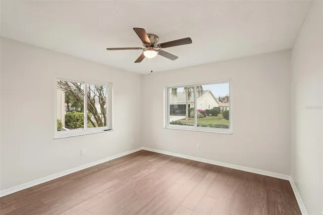 a view of an empty room with a floor to ceiling window