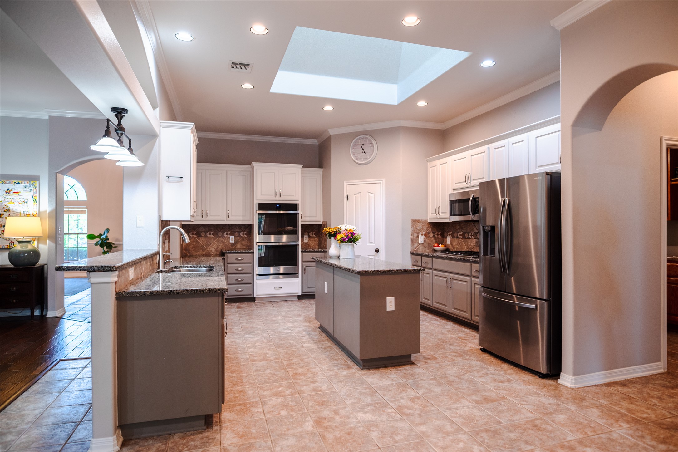 748 Nelson Ranch Road Cedar Park, TX 78613 - Photo 7 of 24 a kitchen with stainless steel appliances kitchen island granite countertop a refrigerator and a stove top oven