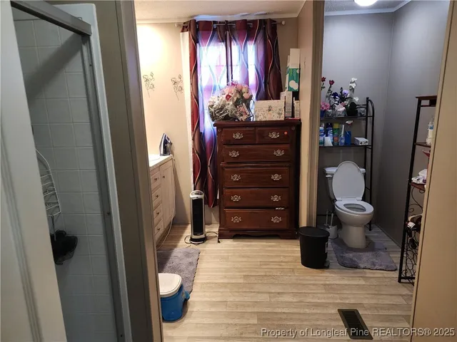 a view of a hallway with front door and furniture