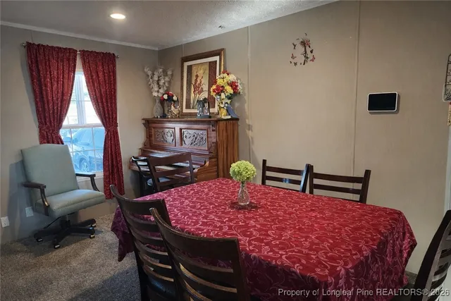 a view of a dining room with furniture
