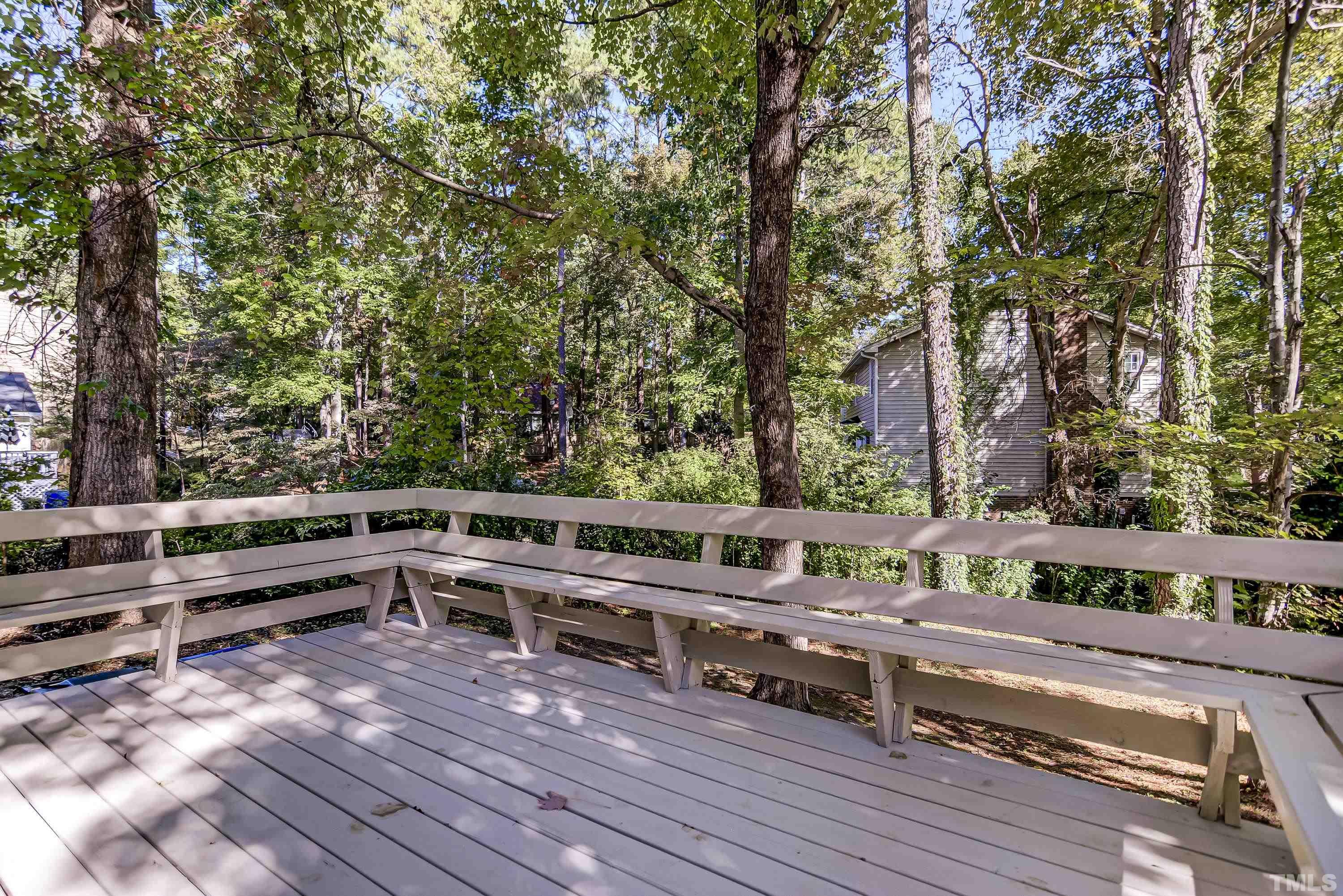 7400 Old Hundred Road Raleigh, NC 27613 - Photo 15 of 17 a view of a yard and deck with a large tree