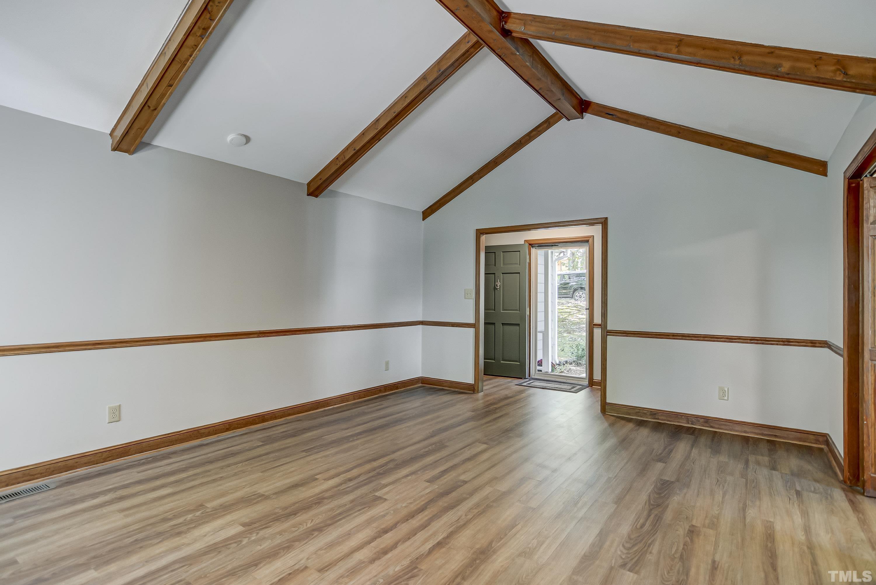7400 Old Hundred Road Raleigh, NC 27613 - Photo 3 of 17 a view of an empty room with wooden floor