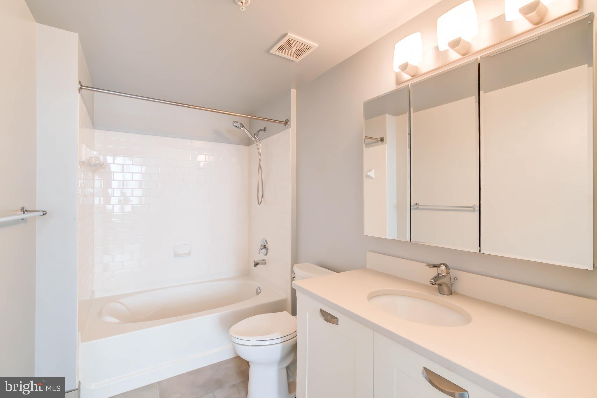 2451 Midtown Avenue, Unit 1327 Alexandria, VA 22303 - Photo 17 of 32 a bathroom with a sink a toilet and a bathtub