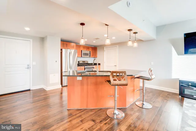a view of a kitchen and dining room