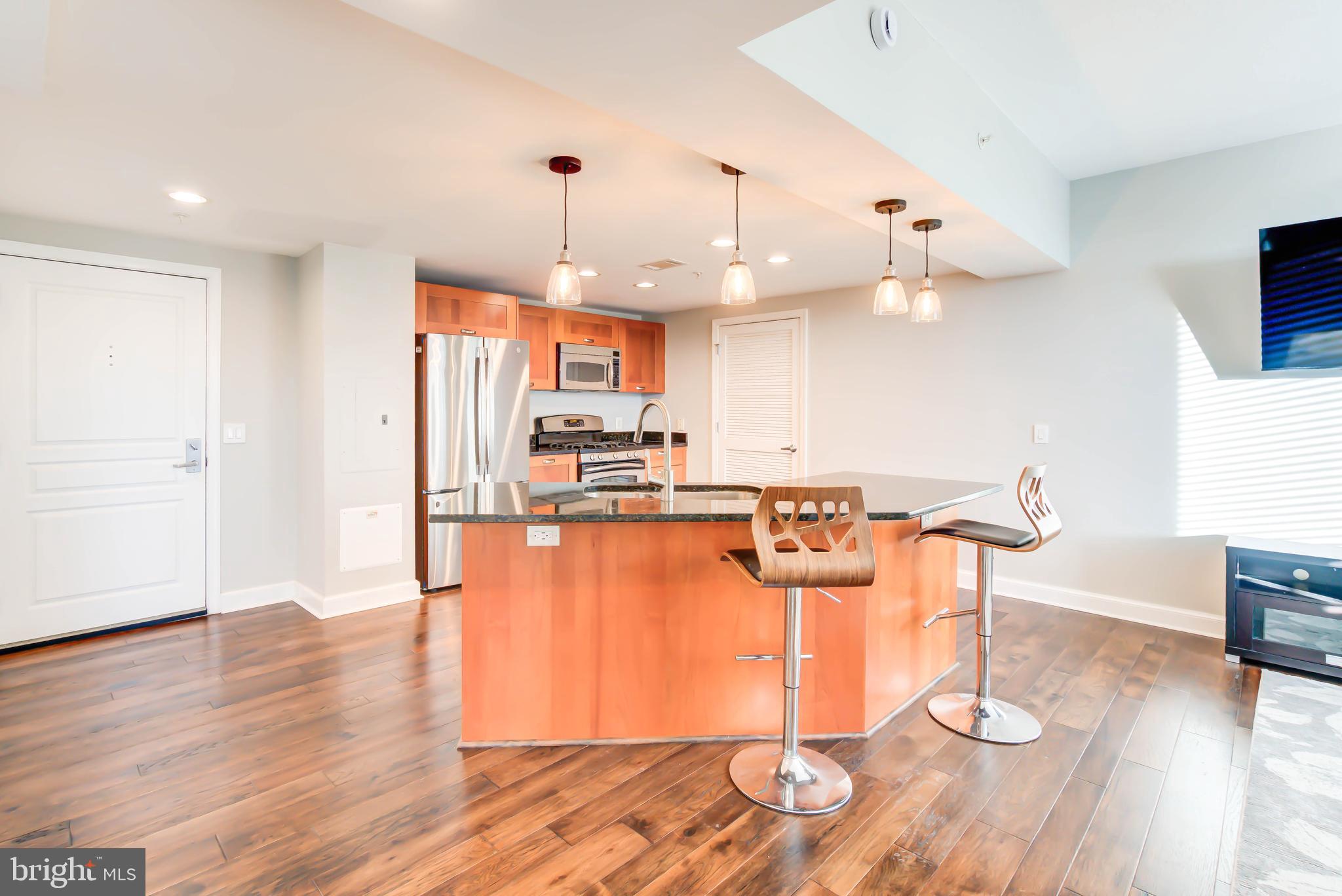 2451 Midtown Avenue, Unit 1327 Alexandria, VA 22303 - Photo 2 of 32 a view of a kitchen and dining room
