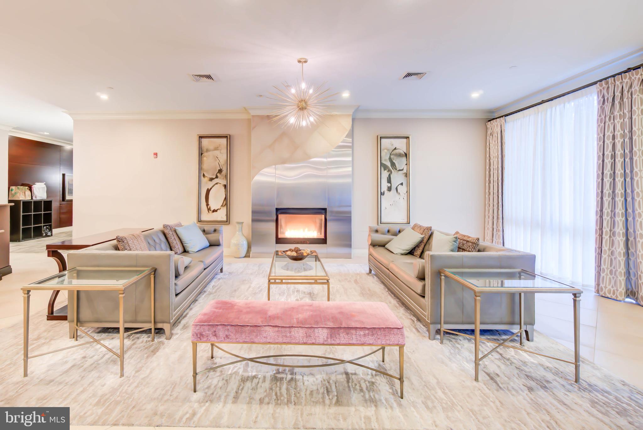 2451 Midtown Avenue, Unit 1327 Alexandria, VA 22303 - Photo 28 of 32 a living room with furniture and a fireplace