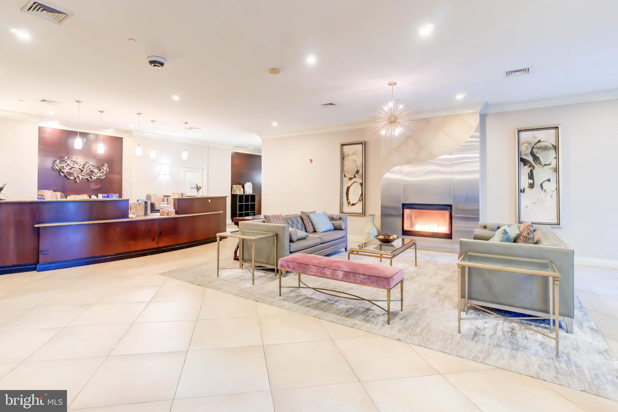 2451 Midtown Avenue, Unit 1327 Alexandria, VA 22303 - Photo 30 of 32 a living room with furniture and a fireplace