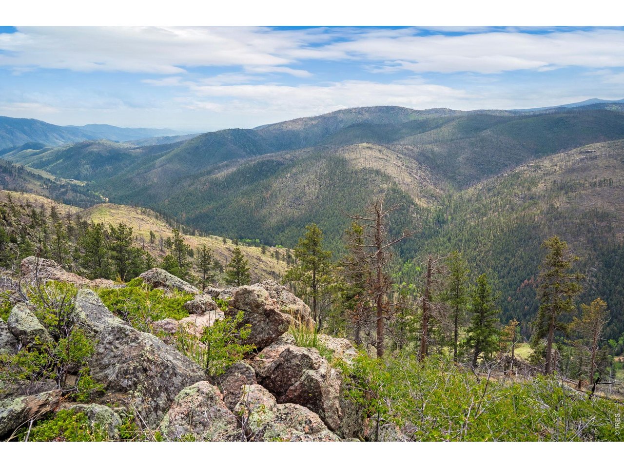 a view of mountains and valleys