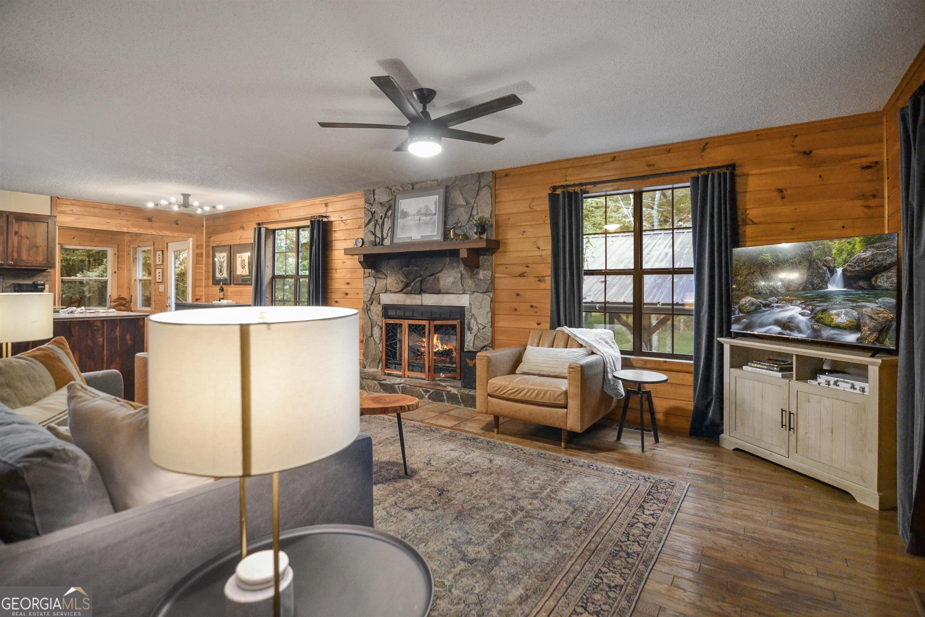 161 Old Dial Road Morganton, GA 30560 - Photo 13 of 40 a living room with furniture a fireplace and a flat screen tv