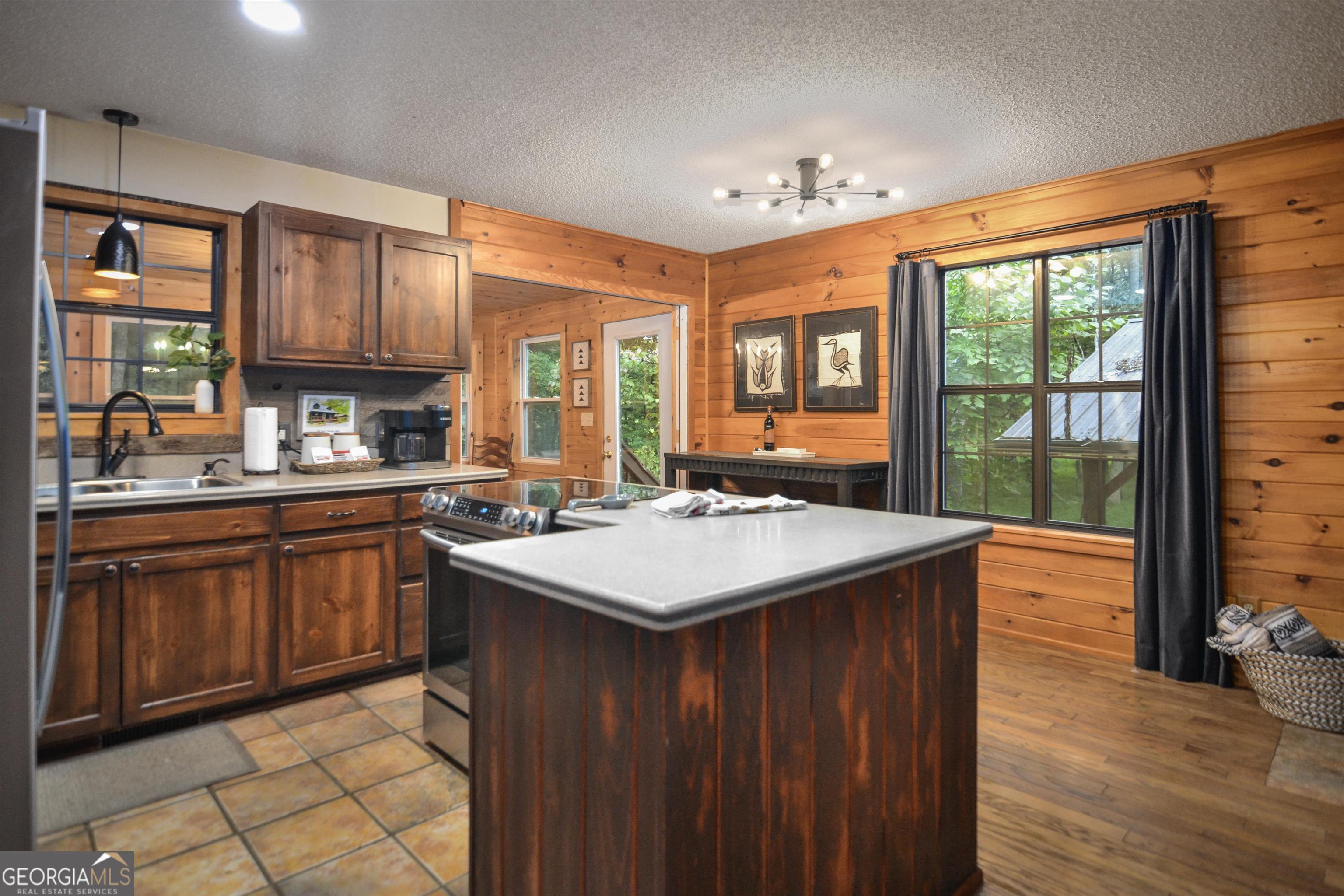 161 Old Dial Road Morganton, GA 30560 - Photo 17 of 40 a kitchen with a sink stove and cabinets