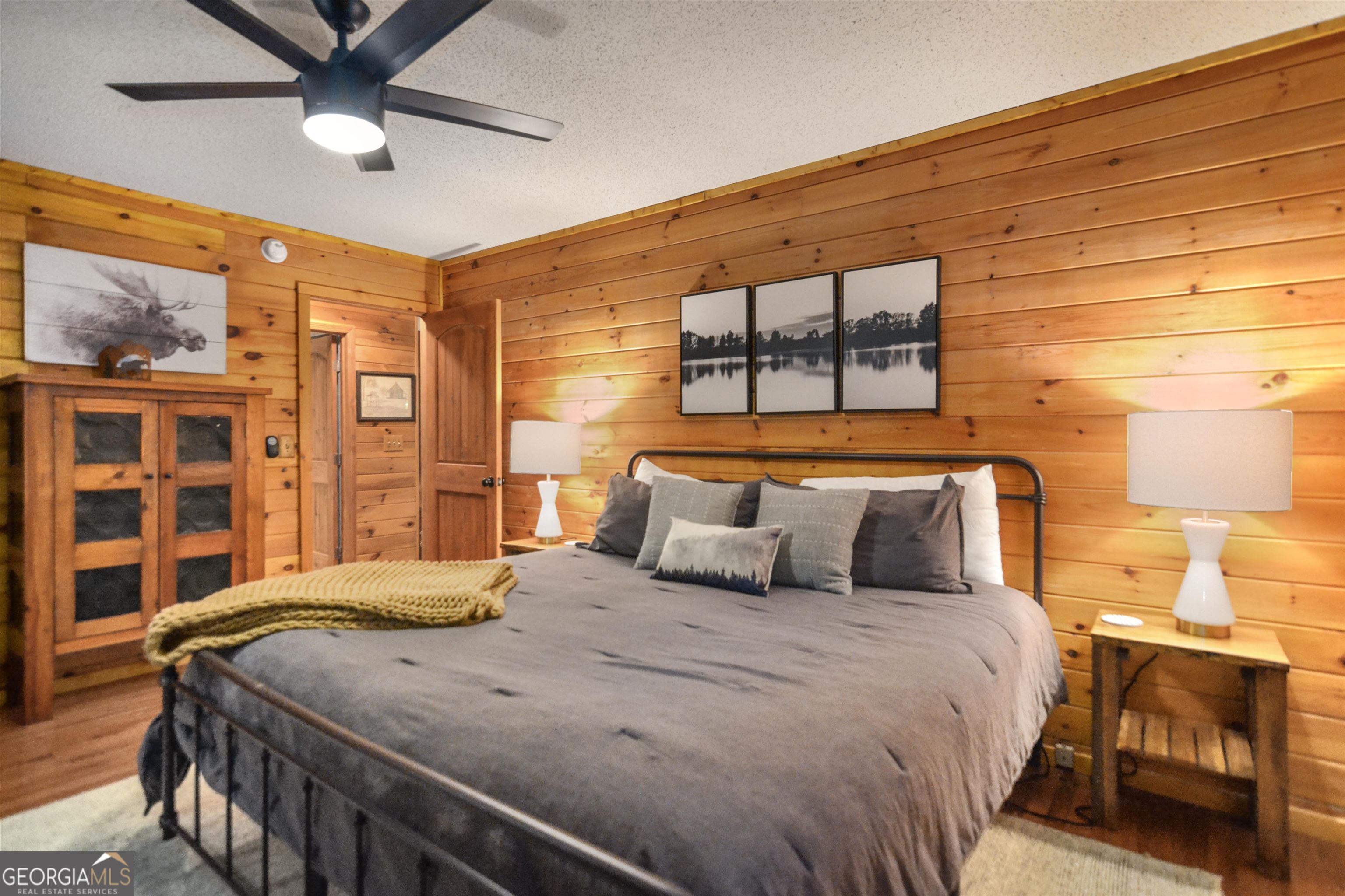 161 Old Dial Road Morganton, GA 30560 - Photo 22 of 40 a bedroom with a bed and a chandelier