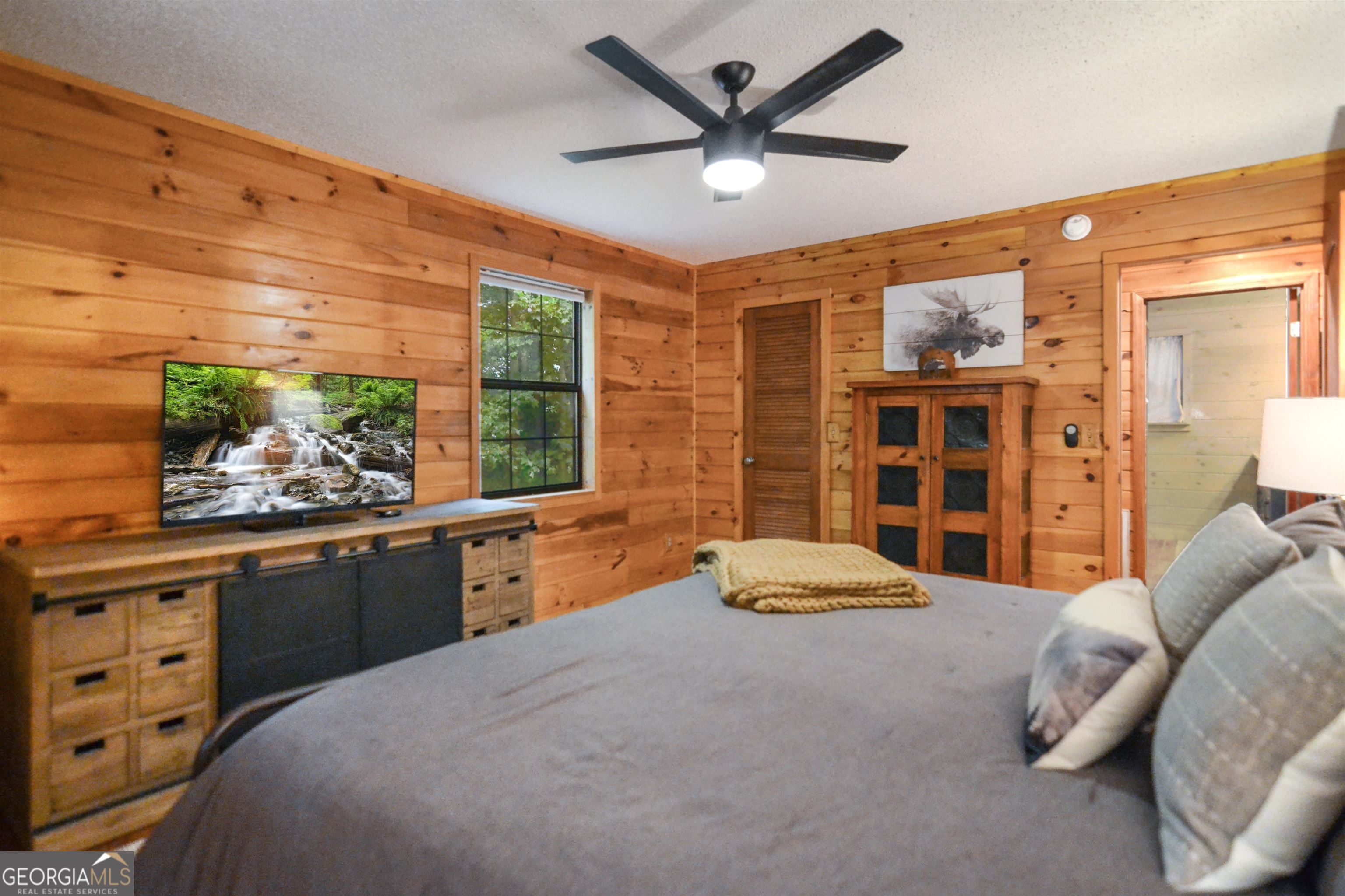 161 Old Dial Road Morganton, GA 30560 - Photo 23 of 40 a bedroom with a bed and a large window with the outer view