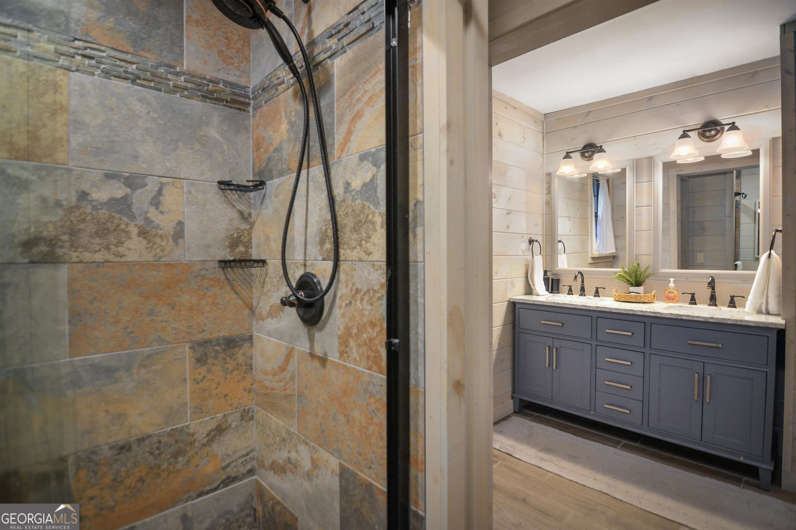 161 Old Dial Road Morganton, GA 30560 - Photo 25 of 40 a bathroom with a granite countertop shower sink and mirror