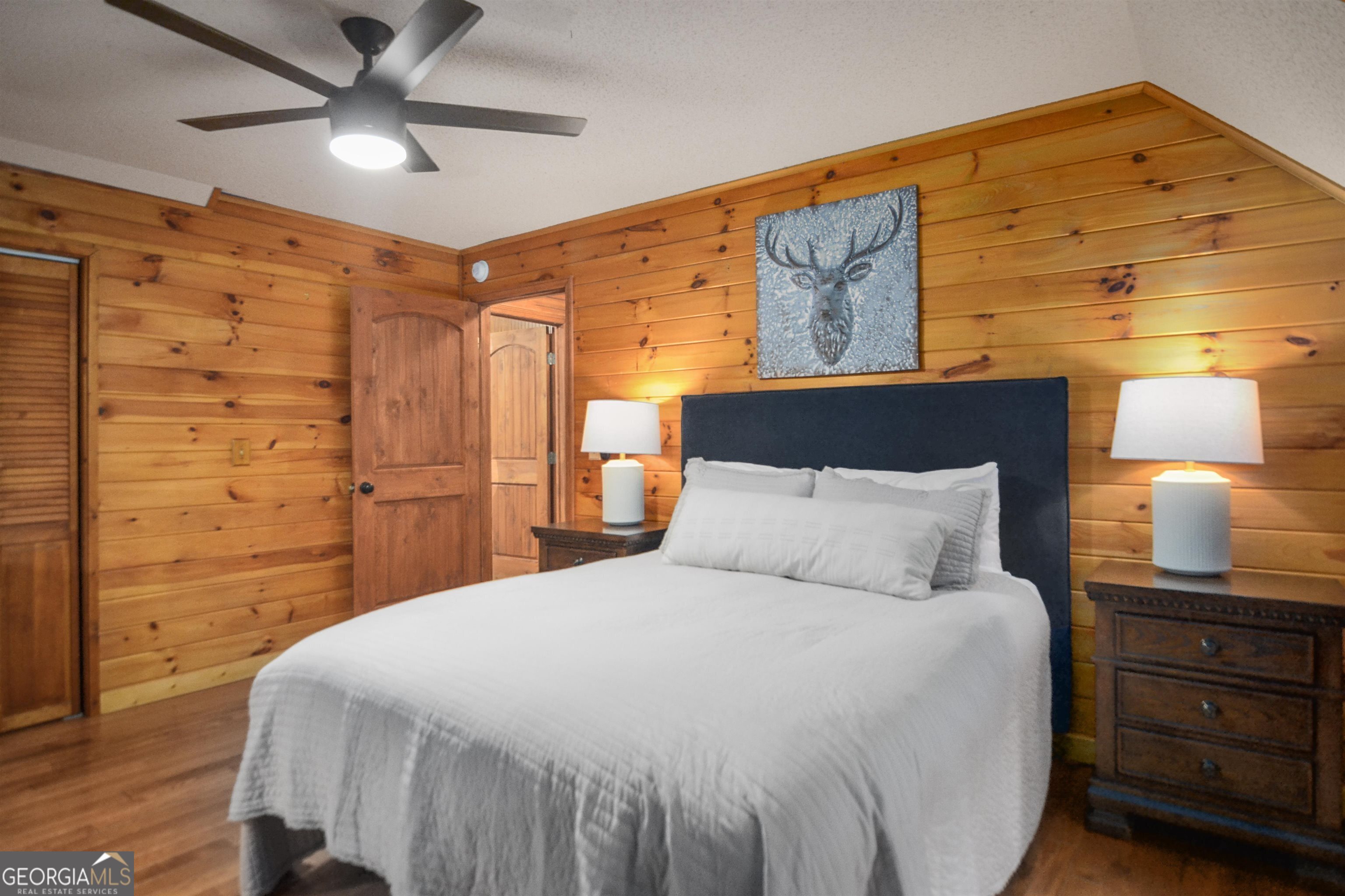 161 Old Dial Road Morganton, GA 30560 - Photo 28 of 40 a bedroom with a bed and a lamp