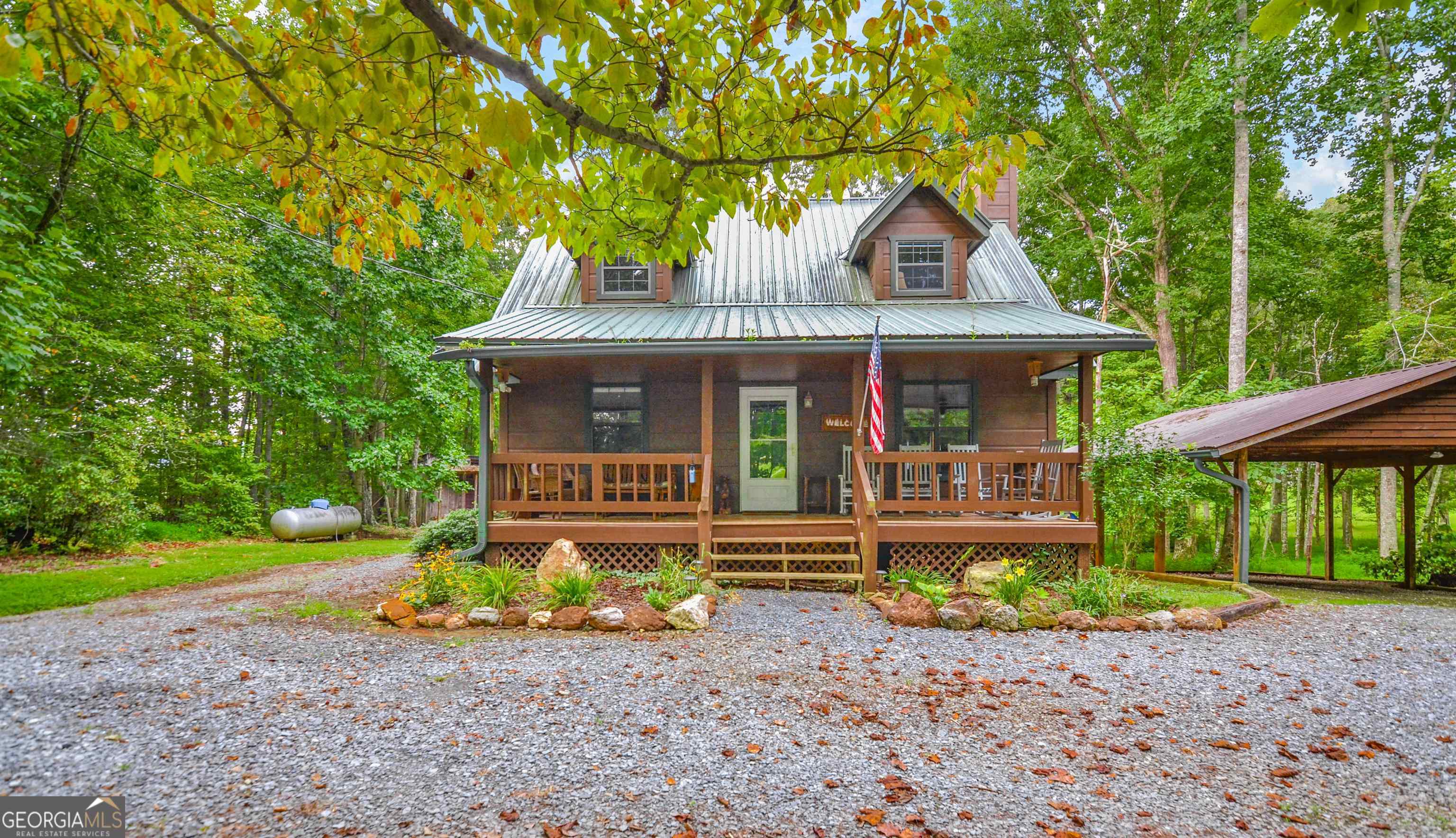 161 Old Dial Road Morganton, GA 30560 - Photo 3 of 40 a front view of a house with garden