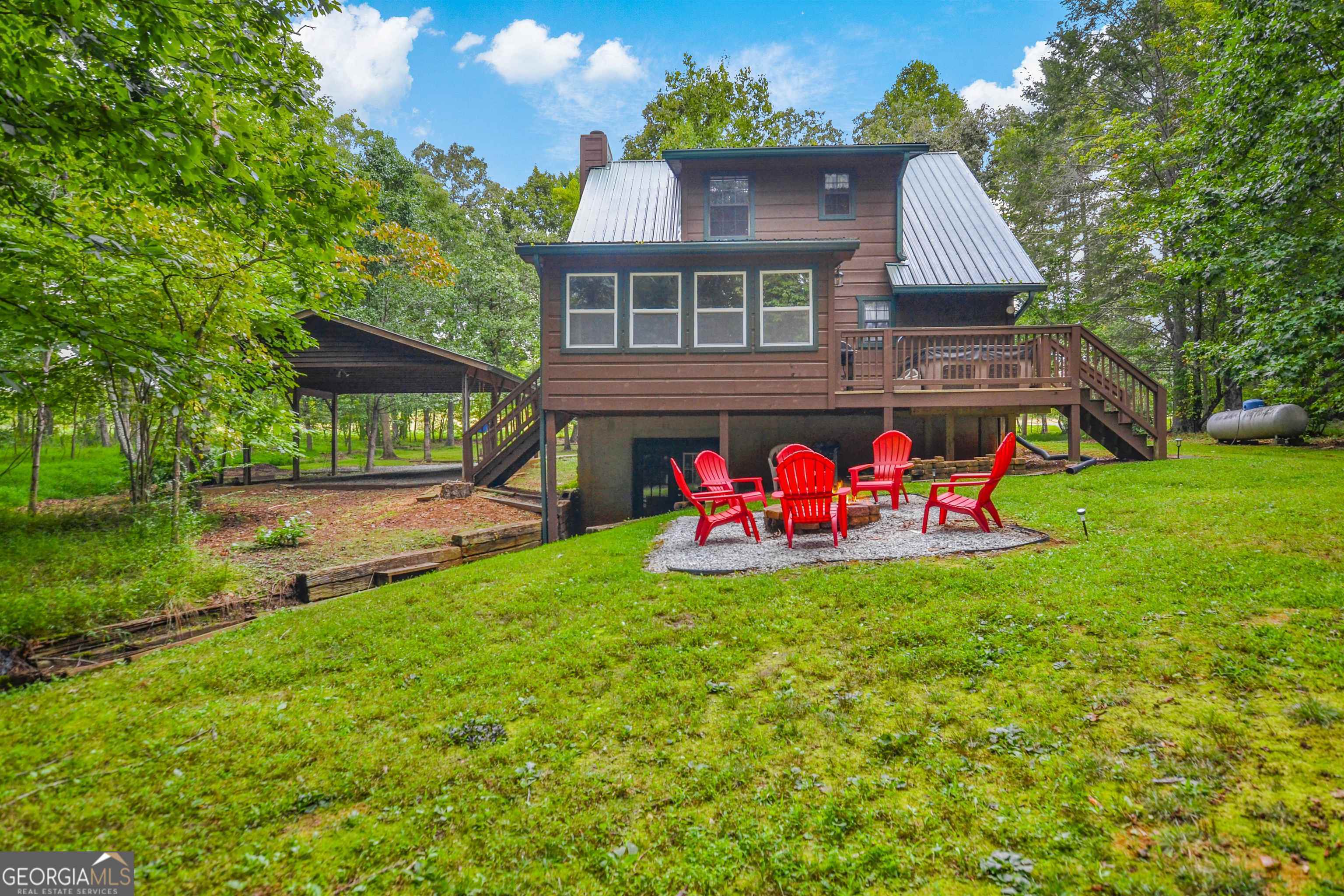 161 Old Dial Road Morganton, GA 30560 - Photo 4 of 40 a backyard of a house with table and chairs