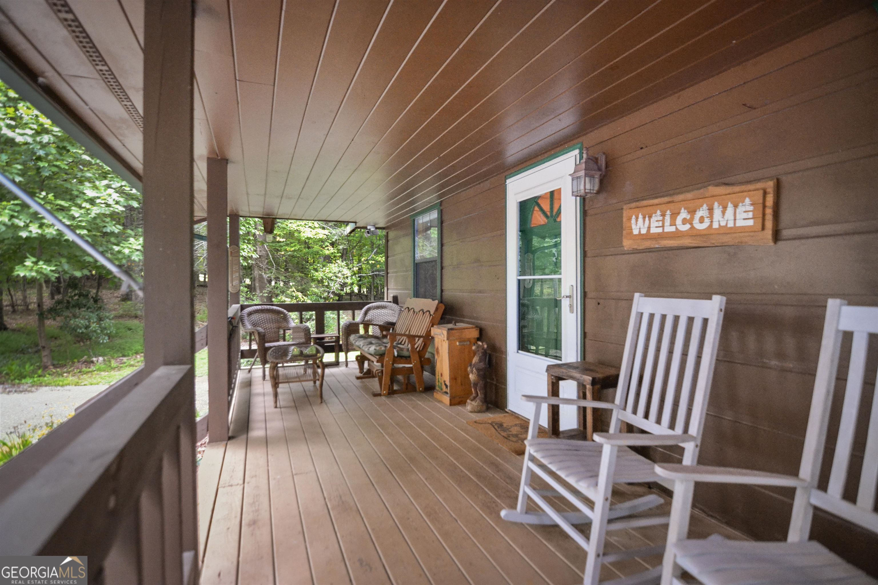 161 Old Dial Road Morganton, GA 30560 - Photo 8 of 40 a view of a patio with table and chairs and wooden floor
