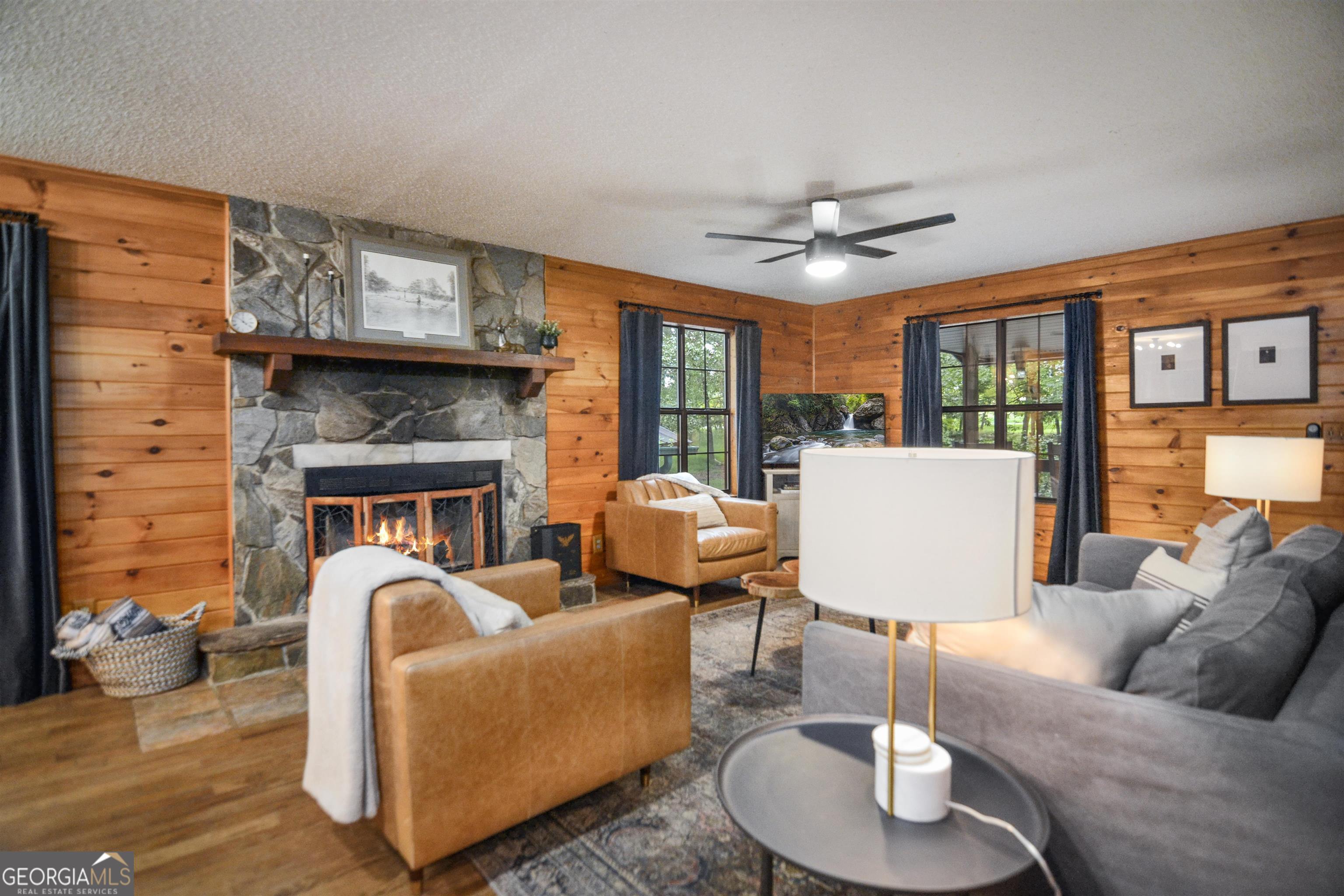 161 Old Dial Road Morganton, GA 30560 - Photo 10 of 40 a living room with furniture a fireplace and a large window