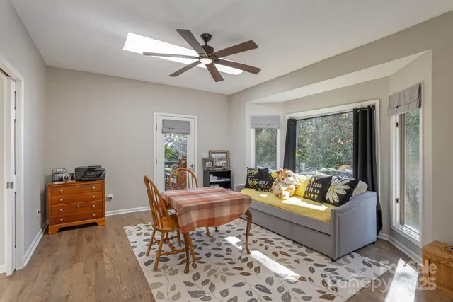 a living room with furniture and a window