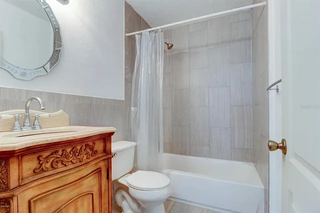 a bathroom with a sink a toilet and a bathtub