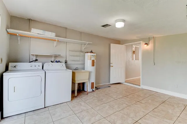 a utility room with dryer and washer