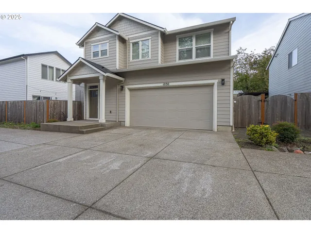 a front view of a house with a garage