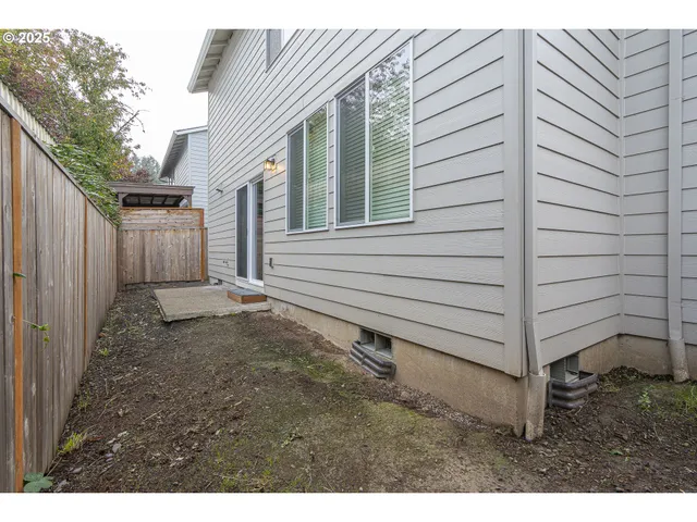 a view of a back yard of the house