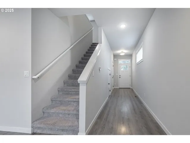 a view of entryway with stairs